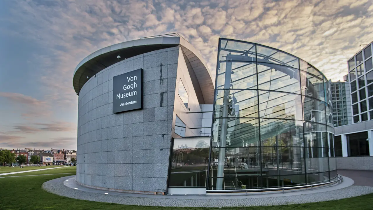 Exterior view of the Van Gogh Museum in Amsterdam featuring modern glass and stone architecture, a top cultural attraction showcasing famous Vincent van Gogh paintings and a must-visit landmark on an Amsterdam travel itinerary.