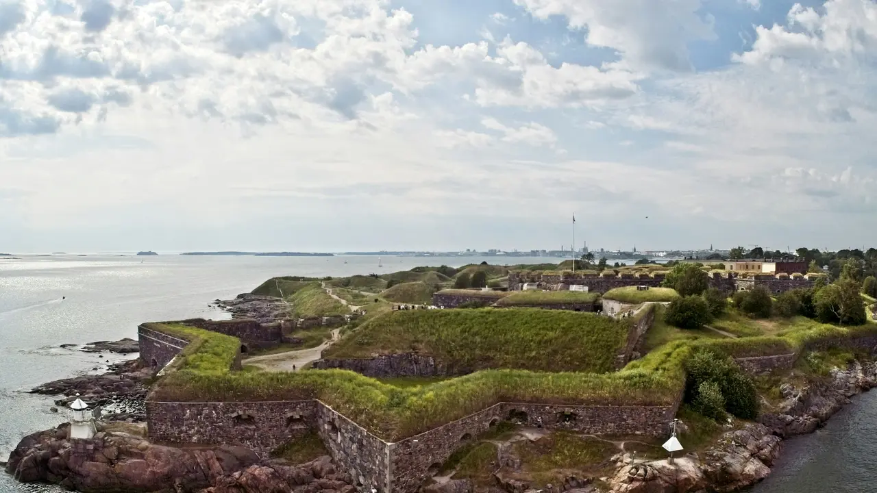 Suomenlinna Fortress in Helsinki, Finland, showcasing historic sea fortifications, grassy bastions, stone walls, and coastal views overlooking the Baltic Sea