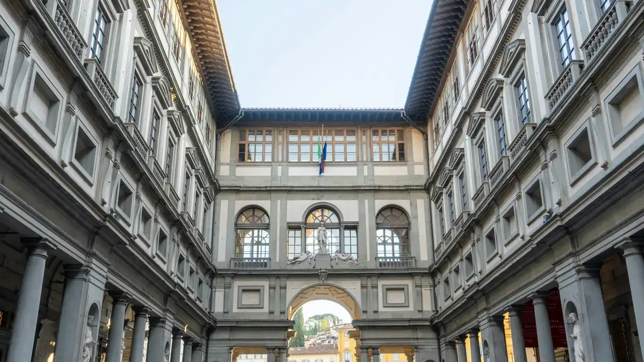 Interior courtyard of the Uffizi Gallery in Florence Italy featuring Renaissance architecture arches columns and statues under open sky