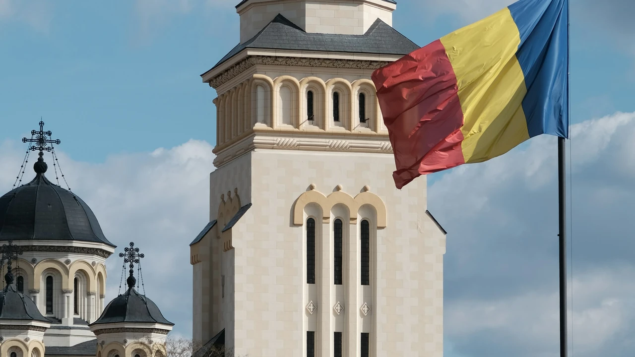 Romanian Flag front of a iconic building