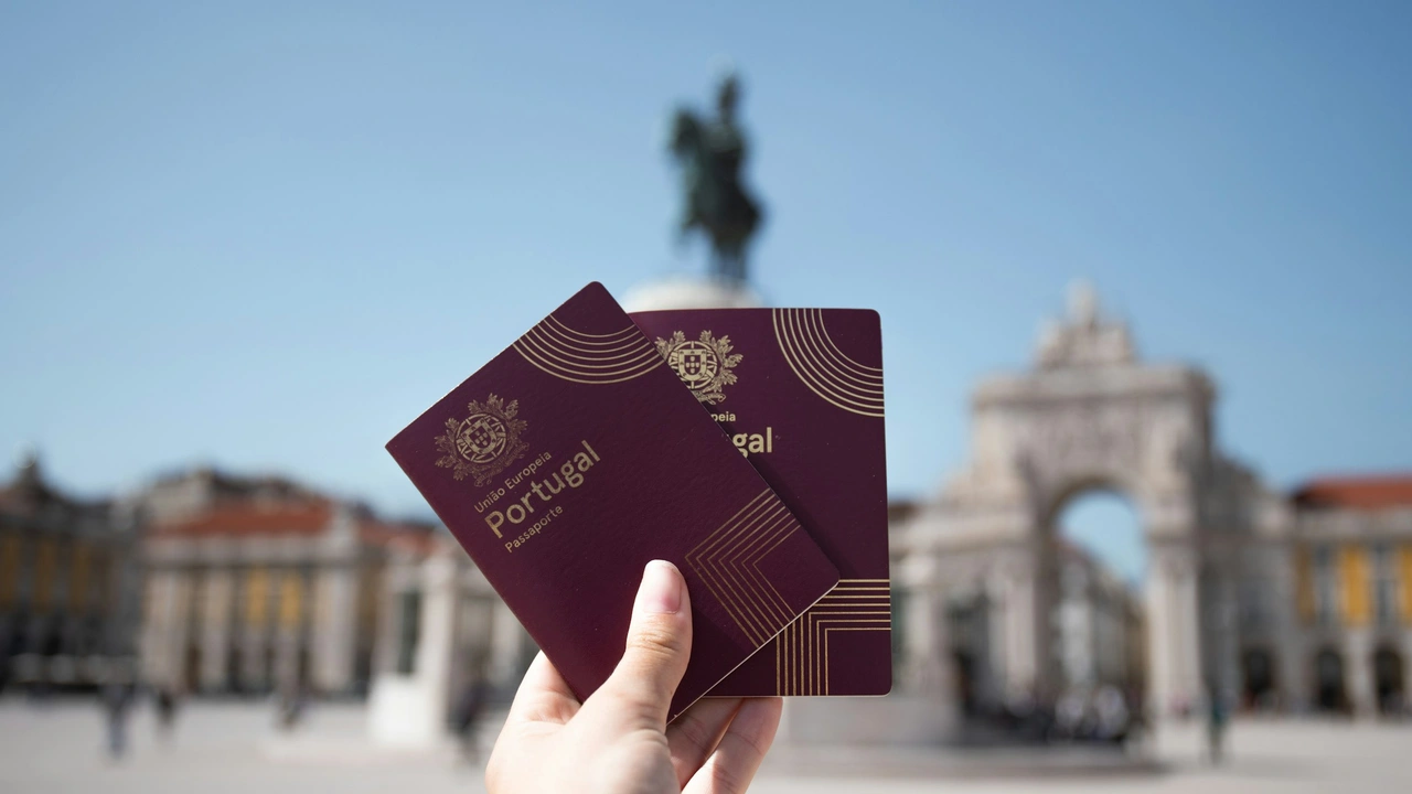 two portugal passport in hands