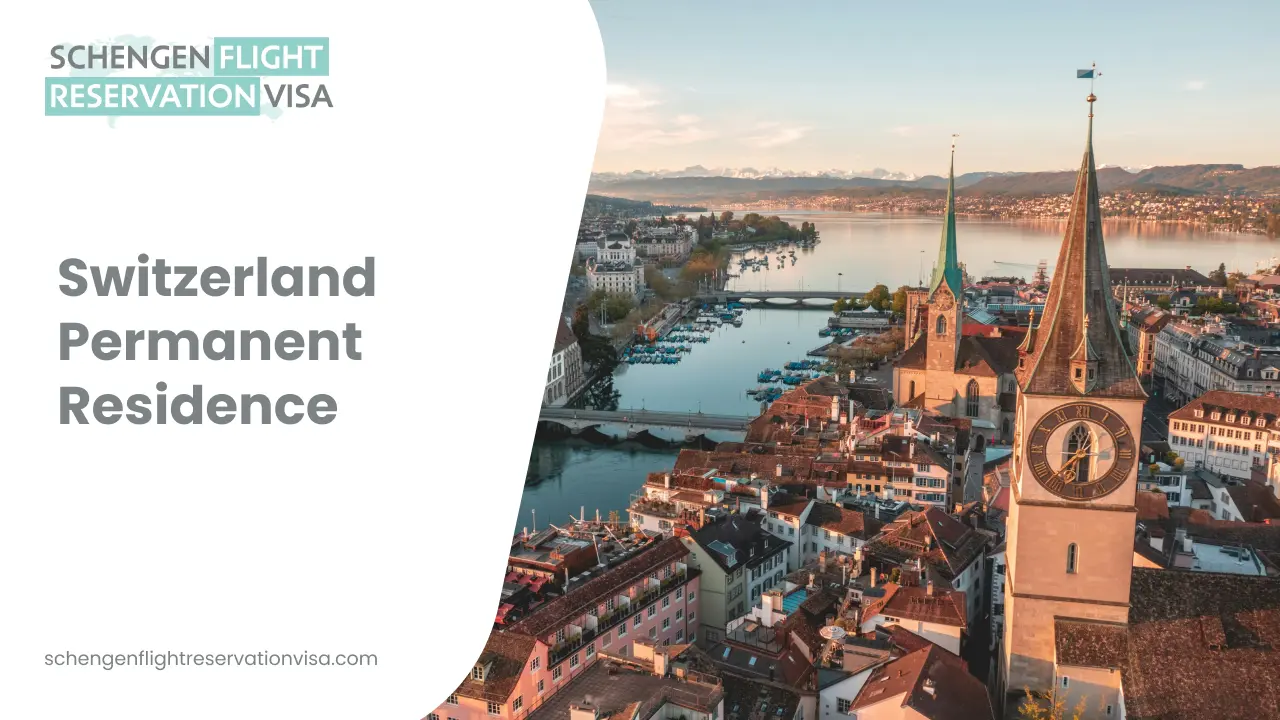An aerial view of Zurich, Switzerland, showcasing the city's historic architecture along the Limmat River and the scenic lake in the background. A prominent church tower with a large clock face stands in the foreground, while snow-capped mountains line the distant horizon