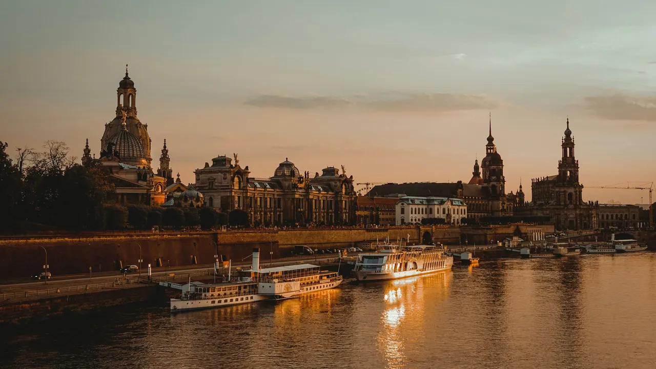 Scenic view of Dresden city skyline in Germany at sunset, featuring historic architecture along the Elbe River, showcasing Germany’s culture, history, and iconic landmarks.
