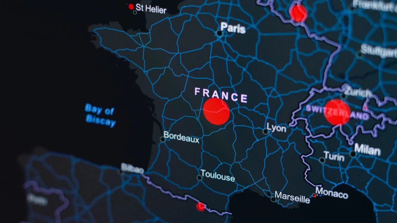 Detailed digital map of France highlighting major cities like Paris, Lyon, Bordeaux, Toulouse, and Marseille, with a red location marker in central France, surrounding road networks, and neighboring countries including Switzerland and Italy.