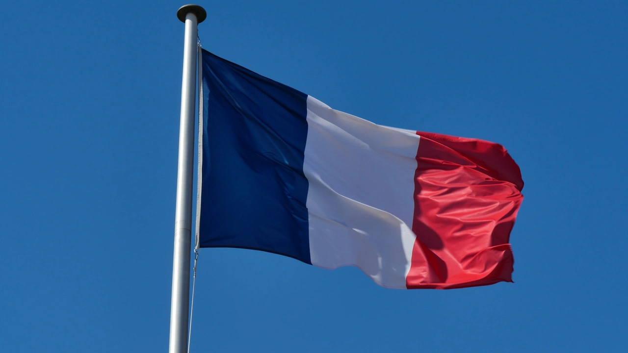 French national flag flying on a flagpole against a clear blue sky, symbolizing France and visa opportunities for travelers from Qatar.