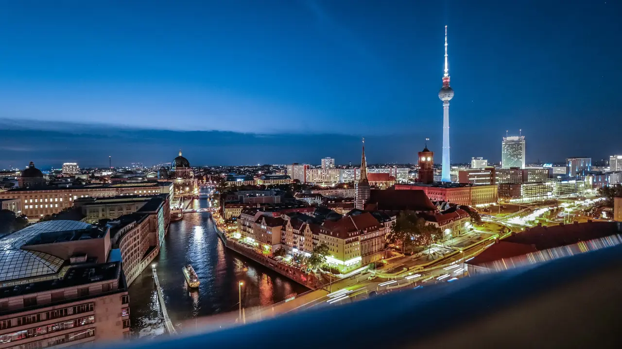 Berlin city skyline at night featuring the TV Tower (Fernsehturm) and River Spree, representing Germany travel, Schengen visa application, and German visa requirements for Ghanaians.