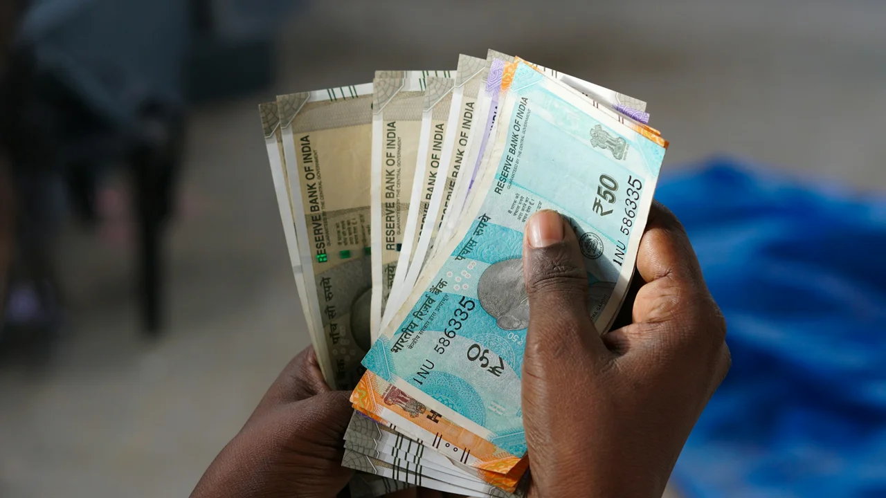 Indian currency notes held in hand representing the visa fee for Morocco visas for Indian citizens, including Morocco visa cost and application expenses for Indians.