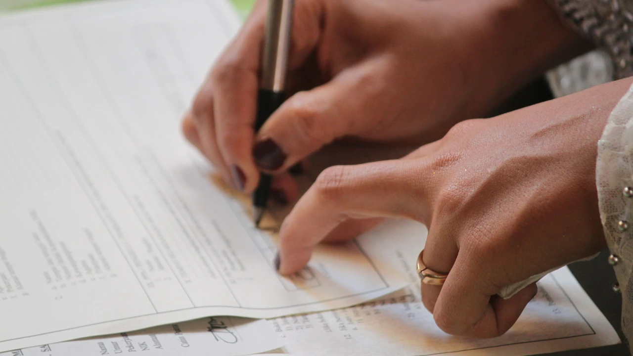 a women writing on documents