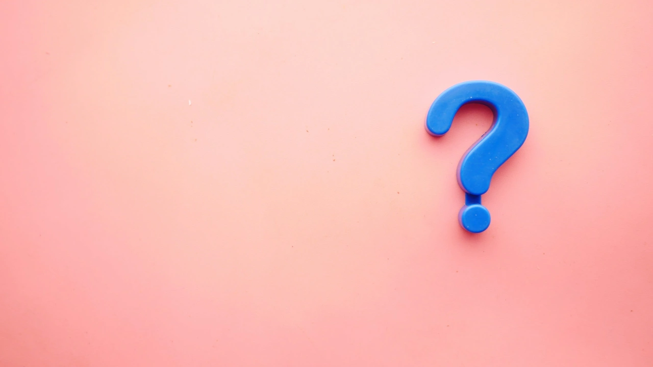 Blue question mark on pink background symbolizing visa FAQs, common questions, and travel information for applicants