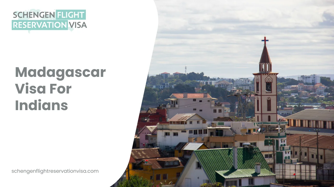 An cityscape view of Antananarivo, Madagascar, featuring a mix of colorful residential buildings and a prominent white church tower with a red spire and cross. On the left side, a white graphic overlay contains the text 