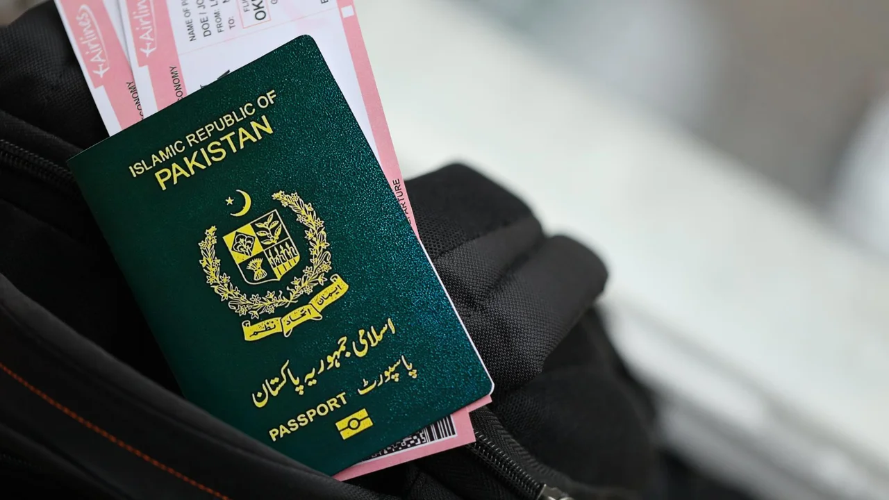 Close-up of a green Pakistan passport from the Islamic Republic of Pakistan with gold emblem, partially tucked into a travel bag alongside airline boarding passes, representing international travel and immigration documentation.