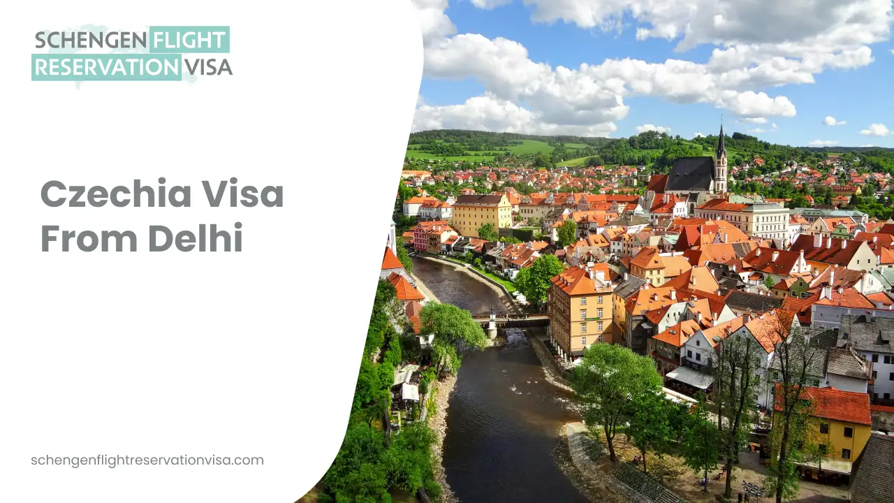 Czechia visa from Delhi banner showing a scenic historic Czech town with red-roofed houses, river, and church under blue sky, promoting Schengen flight reservation visa.